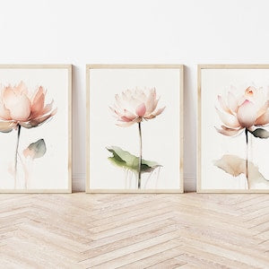 Set of three framed lotus flower prints with pink and white blossoms on floral backgrounds