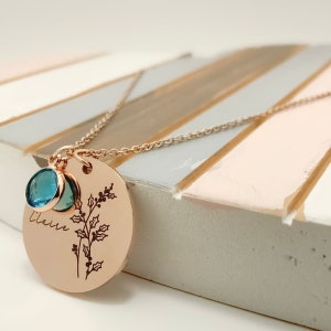 Rose gold birth flower necklace pendant with blue round stone and etched tree design
