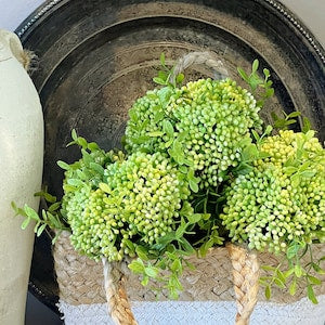 Faux greenery berry cluster bouquet with small green blooms and stems