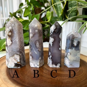 Set of four flower agate crystal towers, gray-purple with white veined patterns (A–D)