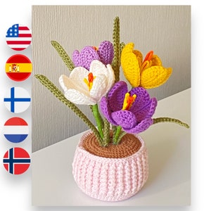Crochet flower bouquet with purple and yellow blooms in pink crocheted pot