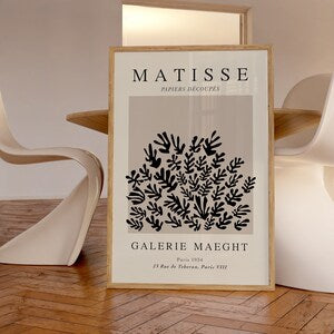 Matisse exhibition poster with black cutout tree branches on cream background
