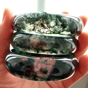 Jadeite bangle set with green and white marbled oval bangles, glossy finish