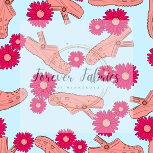 Printed holographic fabric yardage with pink flowers and spool shapes