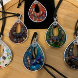 Teardrop floral glass pendant necklace with multicolor flower designs on black cord