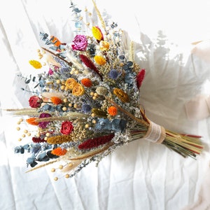 Boho dried bridal bouquet with orange, yellow, blue flowers and greenery