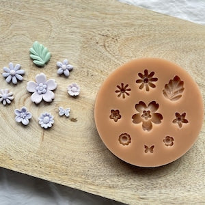Round silicone mold with flower-shaped cavities for baking and desserts