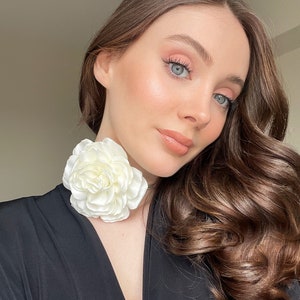 Black choker necklace with large white rose flower detail