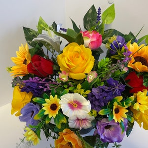 Artificial flat-backed flower pot with vibrant yellow, purple, red blooms and green leaves