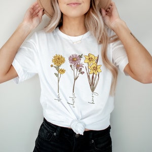 White cropped racerback tank top with flower bouquet graphic