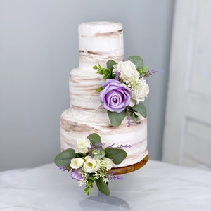 Floral cake topper set with white and lavender purple flowers on stems