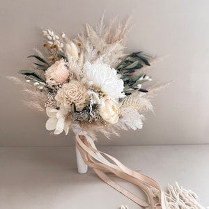 Boho bridal dried flower bouquet with cream pampas, roses, dried blooms, and ribbon wrap