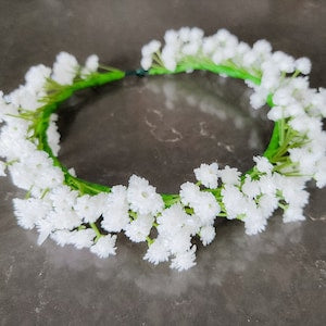 Baby's breath flower crown with white blooms and green leaves, floral halo hair accessory