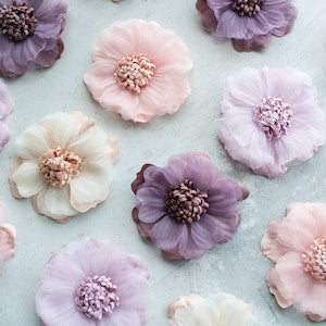 Pastel organza fabric flowers, six-layer blooms with beaded centers in pink and lavender