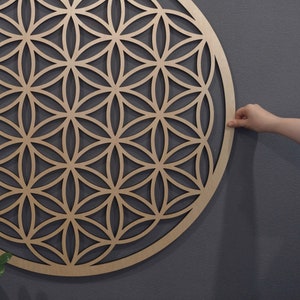 Wooden circular Flower of Life wall decor with laser-cut sacred geometry pattern