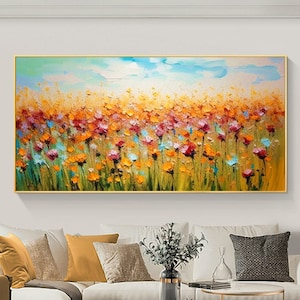 Large textured abstract floral landscape wall art with colorful blooms and blue sky