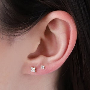 Tiny flower CZ stud earrings with glittering center stones