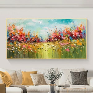 Colorful floral wall painting with abstract blooming field and blue sky