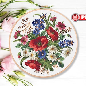 Floral cross stitch pattern with bouquet flowers in round hoop, multicolor