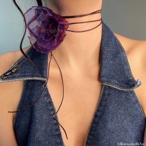 Handmade phantom flower choker with electric purple fabric bloom and black cord ties