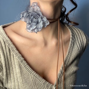 Handmade light-blue flower choker with layered fabric bloom and thin tie cords