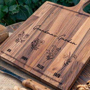 Personalized wooden cutting board with engraved garden names, flowers, and dates