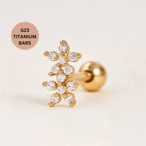 Gold-tone flower stud earring with clear stones and round post