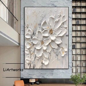 Framed 3D white floral wall art with raised petals and gold flower centers
