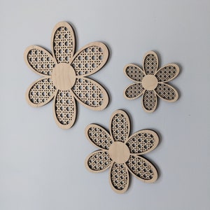 Rattan-inspired flower wall art: three beige woven flower cutouts with dotted centers