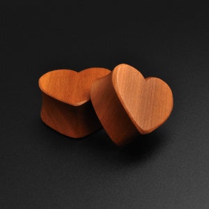 Cherry wood heart-shaped double-flare ear plug gauges, two wooden hearts