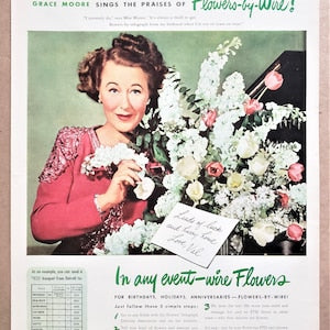 Vintage print ad featuring a woman holding a bouquet and floral offerings in a border