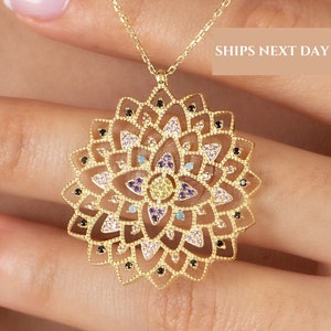 Gold flower of life pendant necklace with ornate geometric bloom design