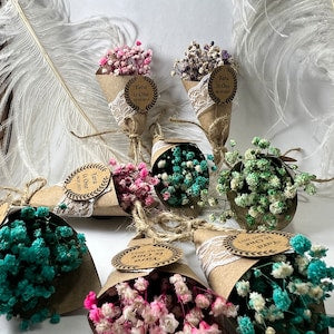 Rustic magnet favors with wood-look circular tags and floral burlap accents