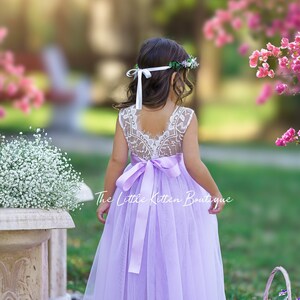 Lilac purple flower girl dress with lace bodice and tied ribbon sash, sleeveless tulle skirt