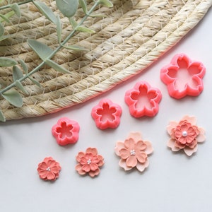 Cherry blossom clay cutter set with embossed flower shapes in pink and red