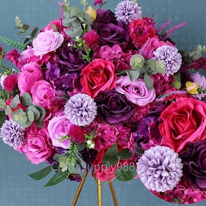 Artificial flower ball centerpiece with fuchsia purple and pink roses and small blooms