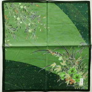 Square green handkerchief with botanical flower and plant pattern, folded