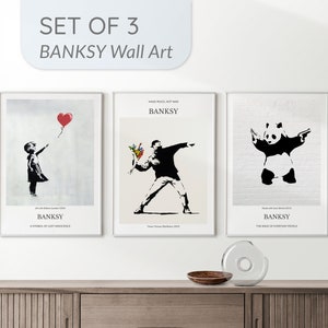 Set of 3 framed wall art prints with black silhouettes and a red heart balloon