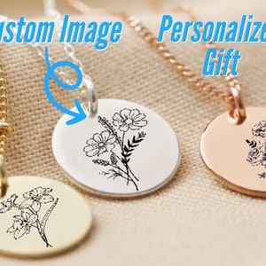 Round birth flower necklace pendant with black engraved flower and leaves, metal tone