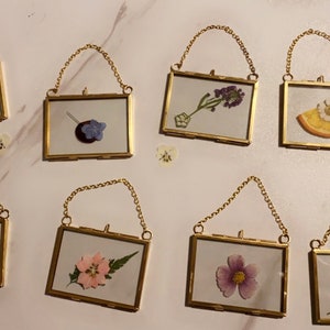 Mini gold glass display frame ornaments with pressed flowers, hanging loop, assorted blooms