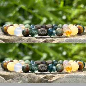 Green gemstone beaded bracelet with round agate-style beads and gold-toned spacers