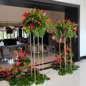 Metal wedding flower stand with tall frame and colorful artificial floral arrangements