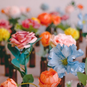 Mixed silk flower bouquet for bud vase, with blue, orange and pink blossoms