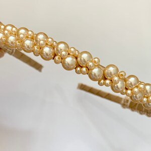 Gold pearl headband with clustered round faux pearls across the band