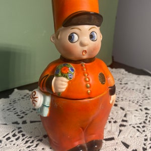 Antique German googly-eye orange toy dresser figurine with round eyes and buttons