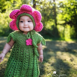 Crochet baby fairy dress with pink flower applique and matching bonnet, green