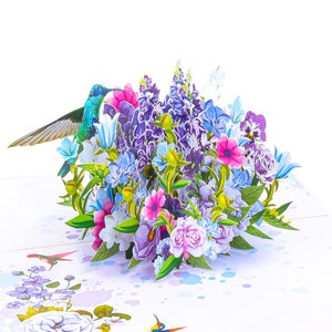 Pop-up greeting card with colorful flowers and a hummingbird