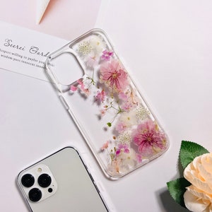 Clear phone case with pink pressed sakura flowers and raised phone-edge protection