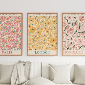Set of 3 botanical flower prints with Paris, London, and Honolulu text, framed