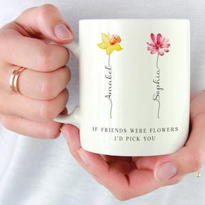 White ceramic mug with flower icons and friendship quote: 'I'd pick you'